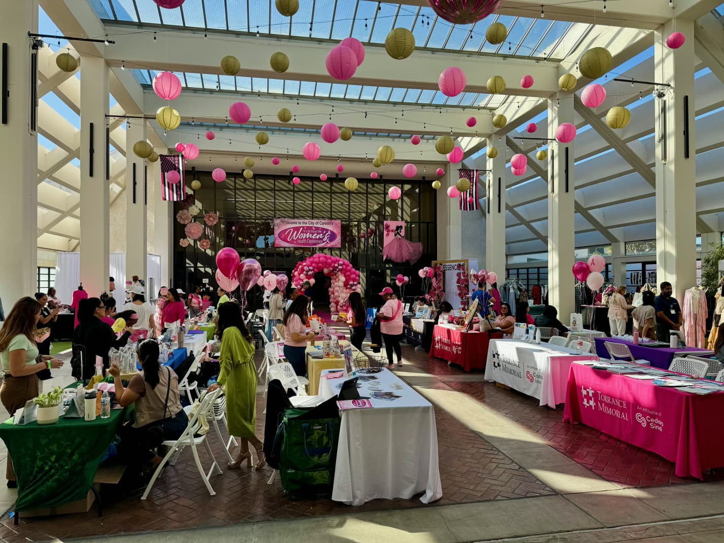 Attendees and booths at the women’s health gathering