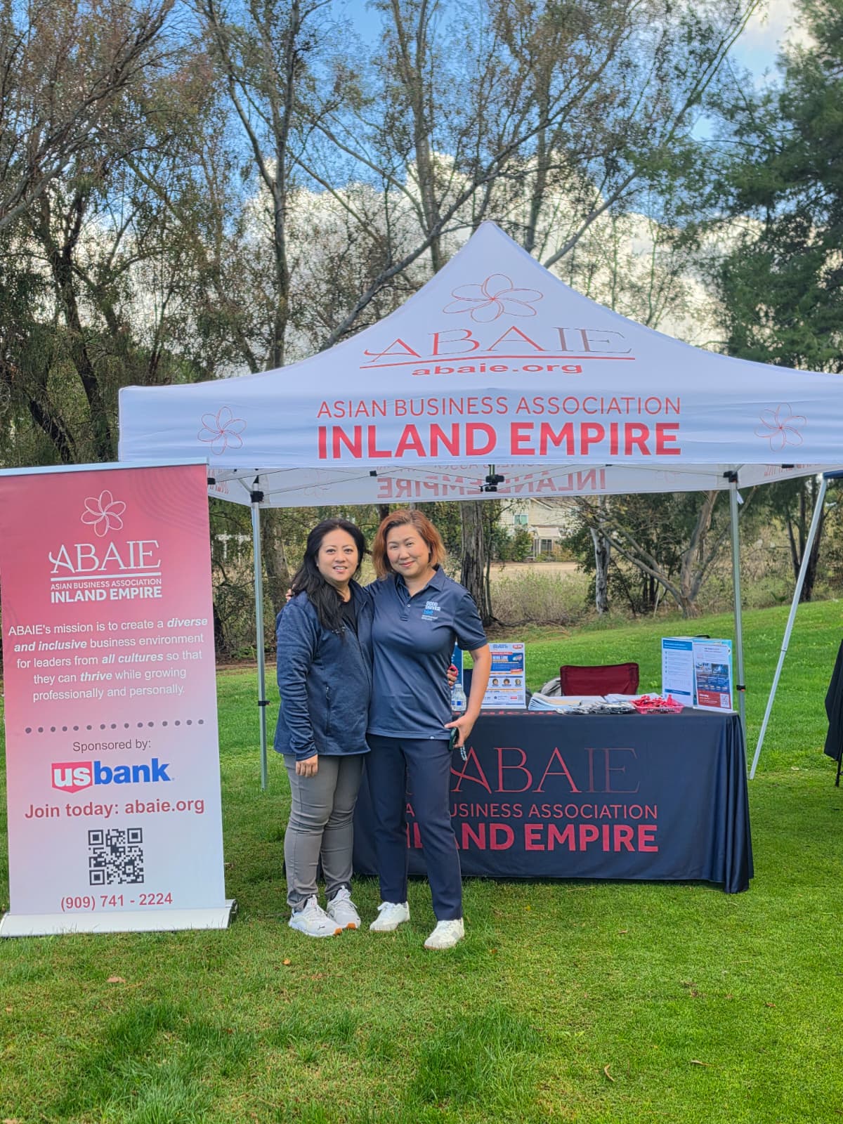 Tanya with another person at the ABAIE community booth
