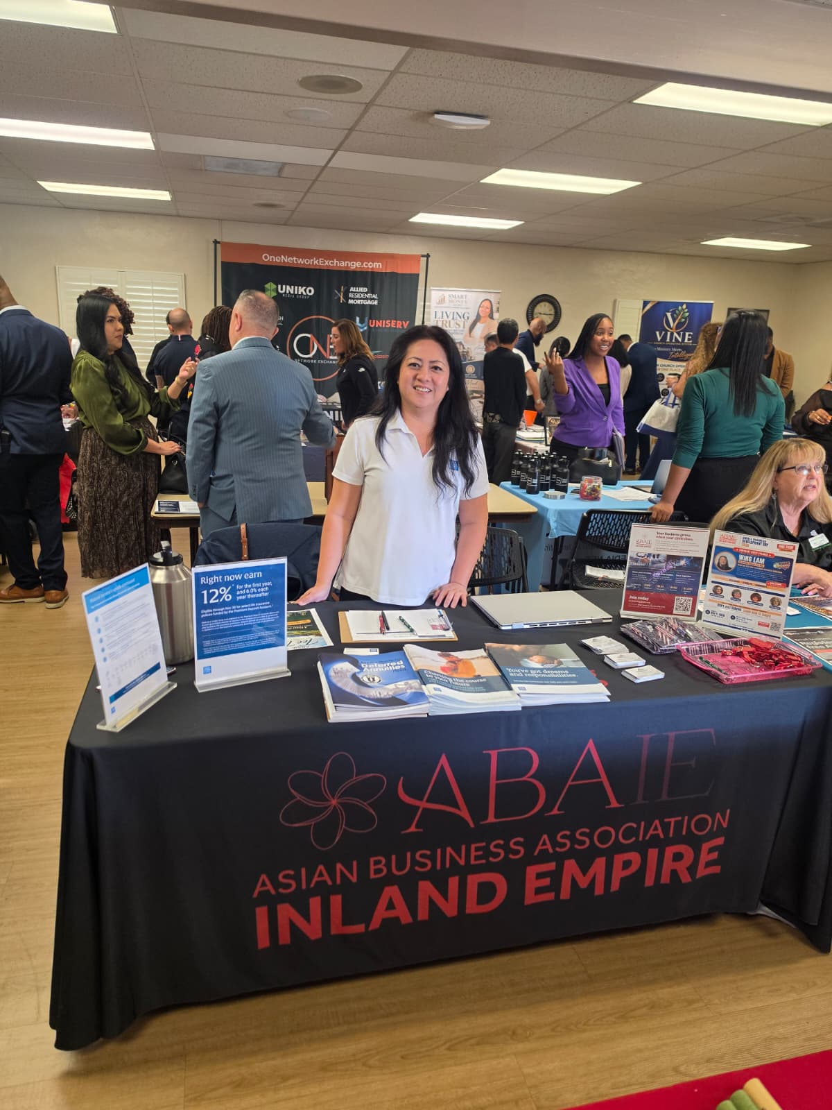 Tanya at an ABAIE table during a local business gathering