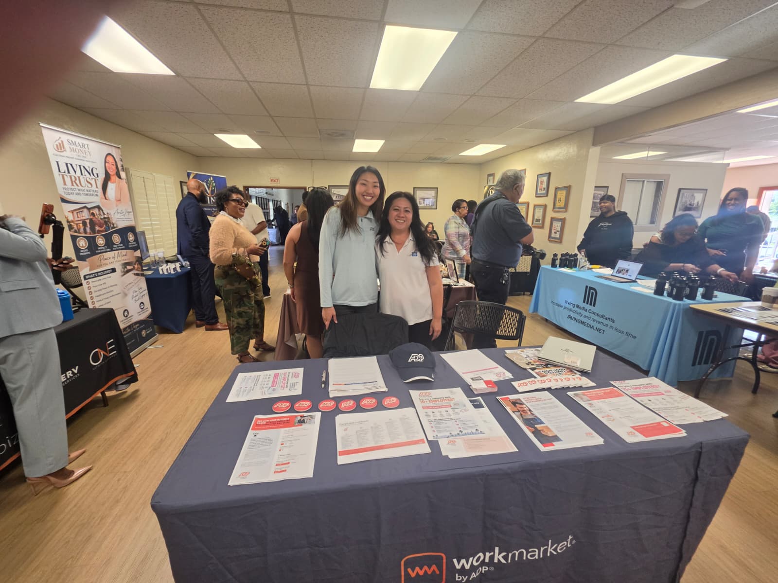 Attendees meeting at an indoor local business gathering