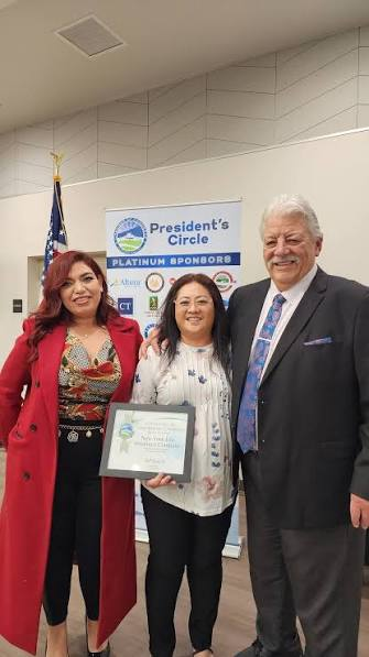 Three people at a Jurupa Valley Chamber of Commerce welcome event